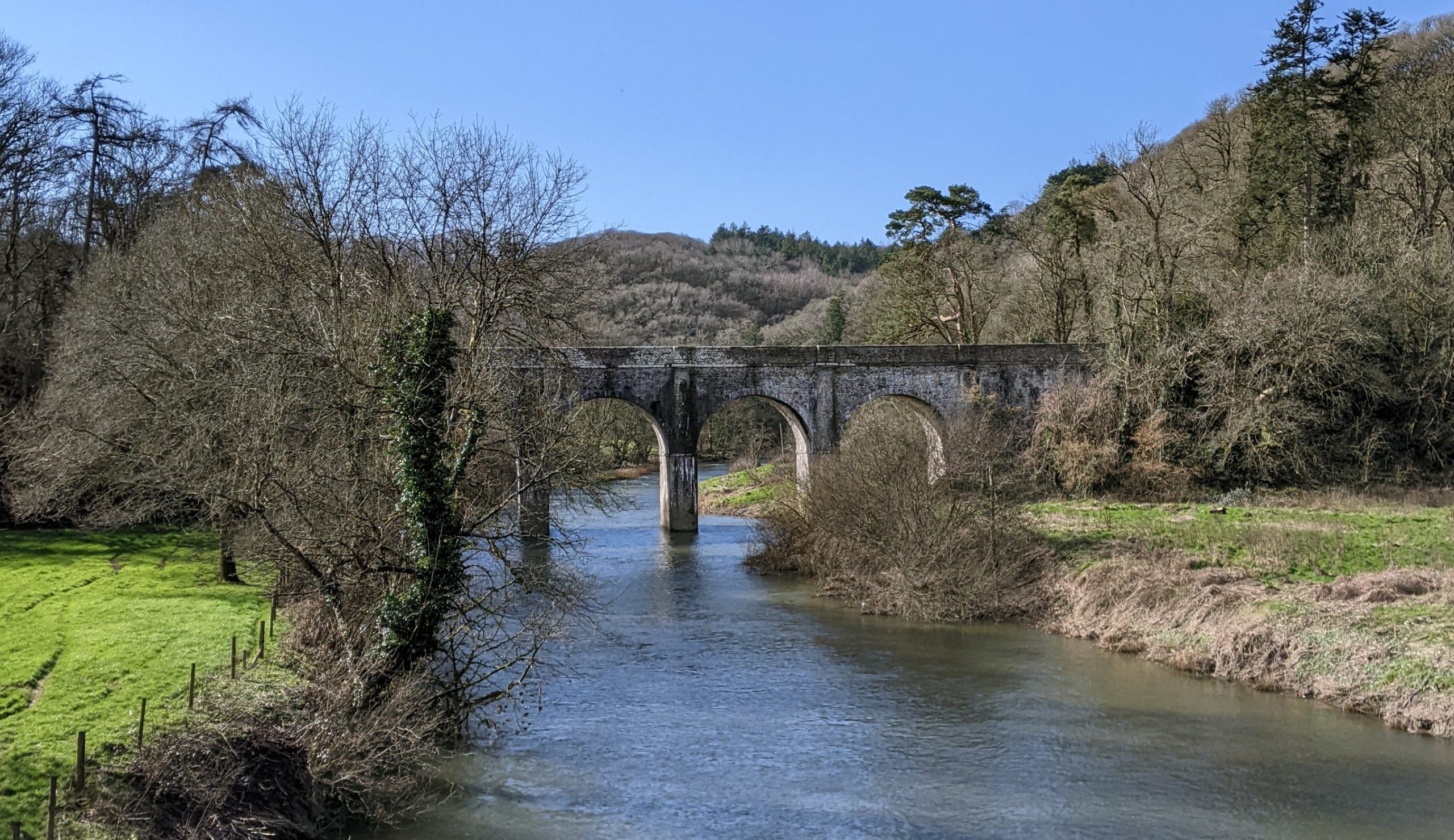 A river leading to a viaduct